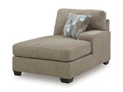 Ashley Furniture Newellen sectional with chaise, angled view of the plush fabric sofa with extended chaise lounge.