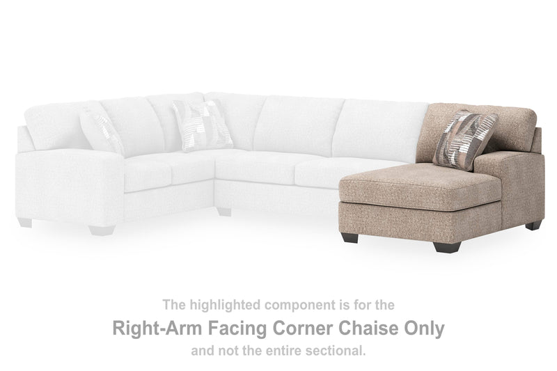 Ashley Furniture Newellen sectional with double chaise, featuring plush upholstery and modern design in a spacious living room setting.