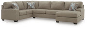 Ashley Furniture Newellen Sleeper Sectional with Chaise, gray fabric, with plush cushions and a chaise lounge for comfortable seating.
