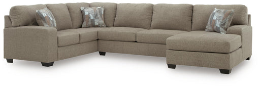 Ashley Furniture Newellen Sleeper Sectional with Chaise, gray fabric, with plush cushions and a chaise lounge for comfortable seating.