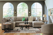 Ashley Furniture Newellen sectional with chaise, featuring plush upholstery and a modern design in a spacious living room.
