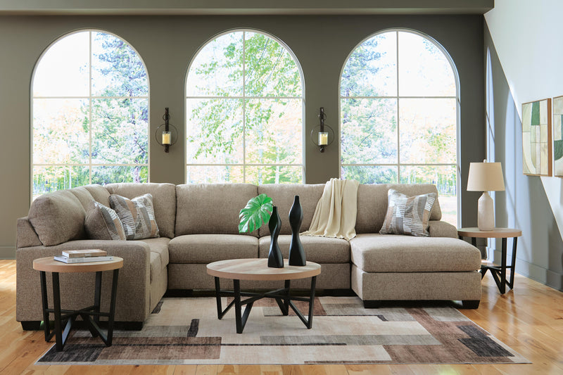 Ashley Furniture Newellen sectional with chaise showing plush fabric, modern design, and spacious seating arrangement.