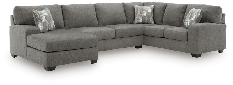 Ashley Furniture Clarington sectional with chaise, featuring plush fabric upholstery and modern design in a spacious living room setting.