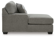 Ashley Furniture Clarington Super Chaise sectional with plush fabric upholstery and modern design, shown from a side view.