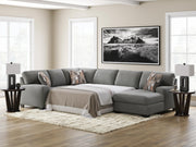 Ashley Furniture Clarington Sleeper Sectional with Chaise, beige fabric, modern design, includes a pull-out bed and spacious chaise lounge.