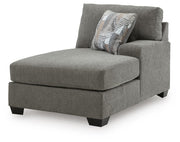 Ashley Furniture Clarington Super Chaise sectional with plush fabric and modern design, shown from an angled view.