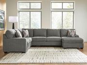 Ashley Furniture Clarington sectional with chaise, featuring plush cushions and a modern design in a neutral fabric.