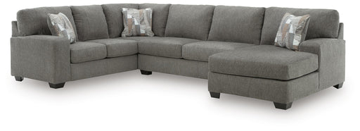Ashley Furniture Clarington sleeper sectional with chaise, featuring plush upholstery and a modern design, shown in a stylish living room.