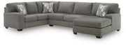 Ashley Furniture Clarington sectional with chaise, featuring plush upholstery and modern design in a spacious living room setting.