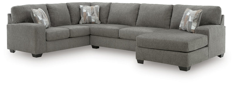 Ashley Furniture Clarington sectional with chaise, featuring plush upholstery and modern design in a spacious living room setting.