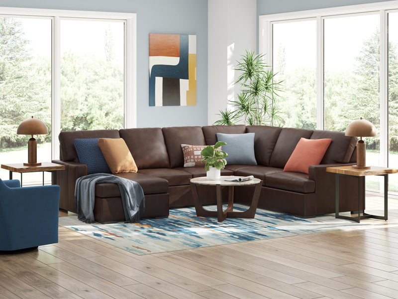 Ashley Furniture McDowlan sectional with chaise, showing plush fabric, cushions, and decorative pillows in a modern living room setting.