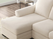 Ashley Furniture Lango Sofa Chaise in beige fabric, showing the detailed close-up of the chofa with plush cushions and modern design features.