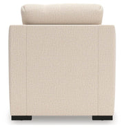 Ashley Furniture Lango living room set with sofa, loveseat, and armchair featuring neutral upholstery and modern design.