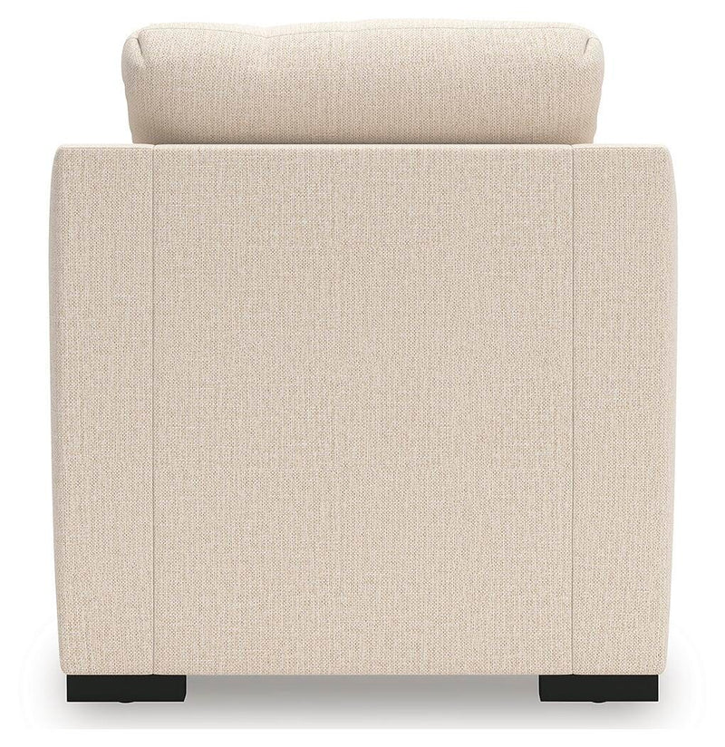 Ashley Furniture Lango living room set with sofa, loveseat, and armchair featuring neutral upholstery and modern design.