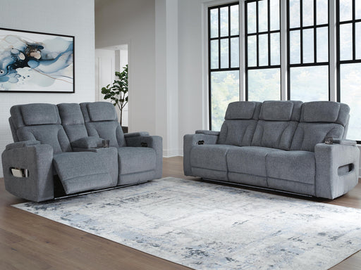Ashley Furniture Studio Cave living room set with sofa and armchair, featuring modern design and neutral upholstery.