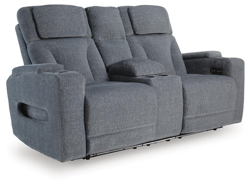 Ashley Furniture Studio Cave power reclining loveseat with console, featuring plush cushions and built-in cupholders on the armrests.