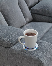 Ashley Furniture Studio Cave living room set with plush cushions and a built-in cup holder in a modern design.