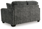 Ashley Furniture Lonoke living room set with sofa and loveseat, featuring neutral upholstery and plush cushions.