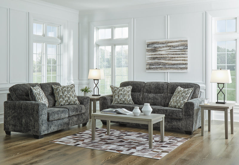 Ashley Furniture Lonoke living room set featuring a sofa and armchair with neutral upholstery and modern design.