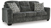Ashley Furniture Lonoke living room set with sofa and loveseat, shown from an angled side view in a modern home setting.