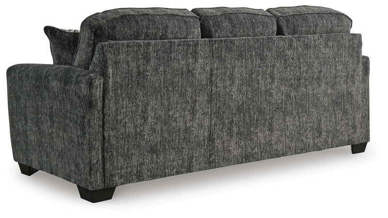 Ashley Furniture Lonoke living room set with plush sofa and matching armchair, shown from the back in this image.