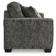 Ashley Furniture Lonoke living room set with sofa and loveseat, featuring neutral fabric upholstery and wooden legs.