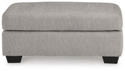 Ashley Furniture Avenal Park living room set with a sofa and armchair, featuring neutral fabric upholstery and plush cushions.