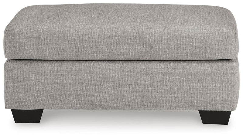 Ashley Furniture Avenal Park living room set with a sofa and armchair, featuring neutral fabric upholstery and plush cushions.