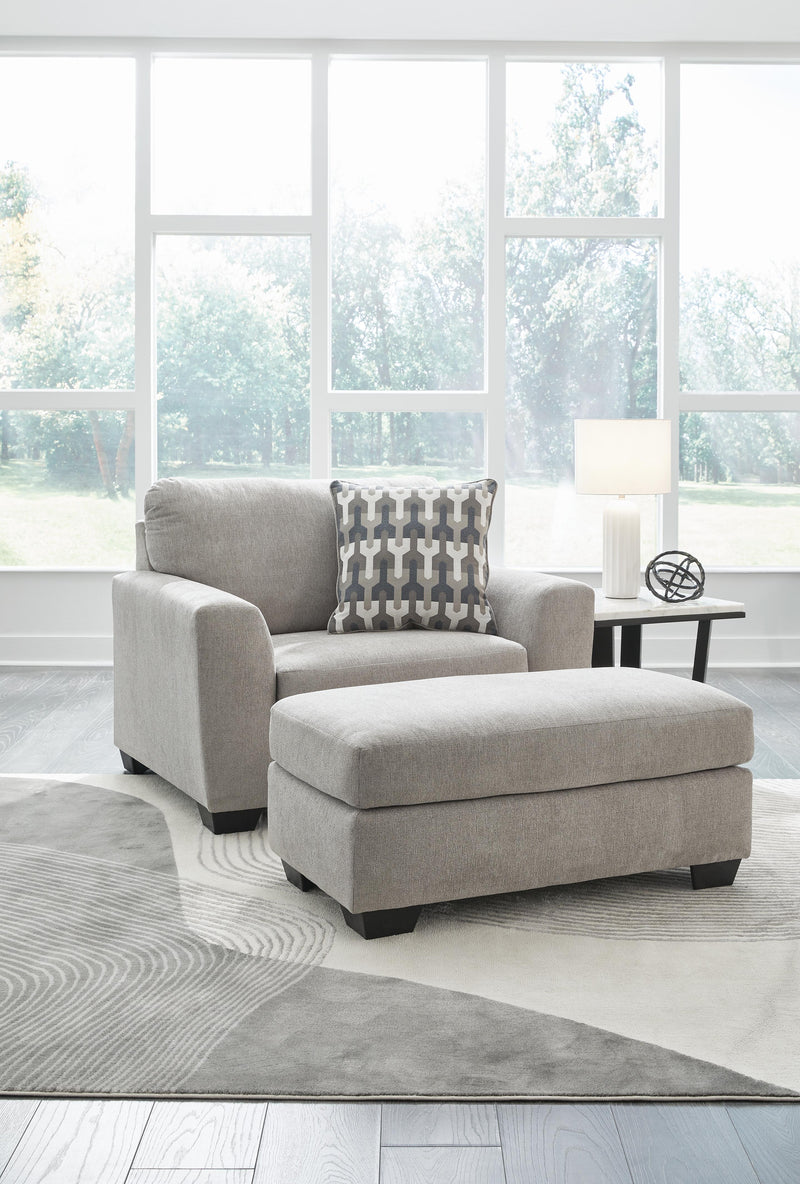 Ashley Furniture Avenal Park living room set with plush sofa and armchair, featuring neutral upholstery and wooden accents.
