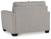 Avenal Park oversized chair by Ashley Furniture showing plush fabric upholstery and wide armrests from a side view.