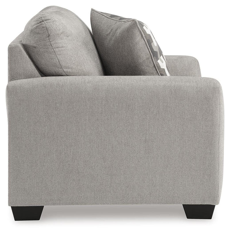 Ashley Furniture Avenal Park oversized chair in beige fabric, shown from the side with plush cushions and wide armrests.