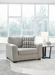 A large, plush Avenal Park Oversized Chair by Ashley Furniture with soft fabric and comfortable cushioning in a modern living room setting.