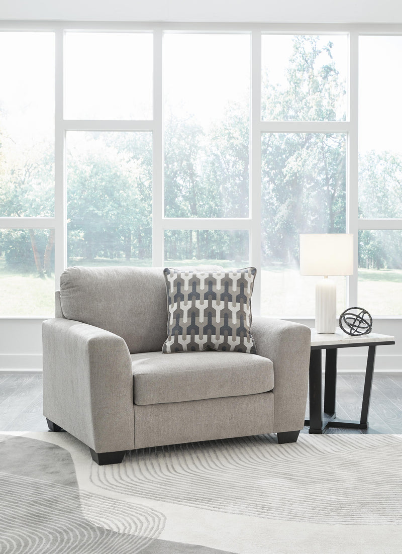 A large, plush Avenal Park Oversized Chair by Ashley Furniture with soft fabric and comfortable cushioning in a modern living room setting.