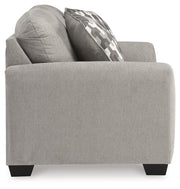 Ashley Furniture Avenal Park loveseat with plush fabric and cushioned armrests, shown from a side angle.