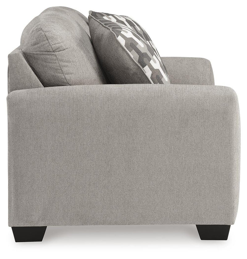 Ashley Furniture Avenal Park loveseat with plush fabric and cushioned armrests, shown from a side angle.
