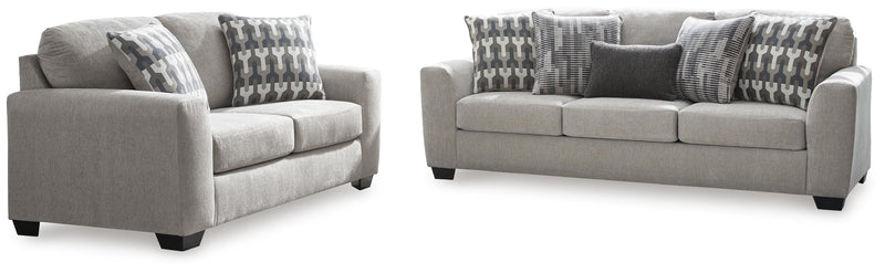 Ashley Furniture Avenal Park living room set with sofa and armchair, upholstered in dark blue fabric, in a modern living room setting.