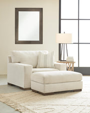 Ashley Furniture Maggie living room set with sofa and loveseat in neutral fabric, modern design with plush cushions.