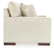 Ashley Furniture Maggie Loveseat with plush fabric and cushioned arms, showcasing a stylish and comfortable two-seat living room sofa.