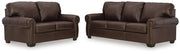 Ashley Furniture Colleton living room set with sofa and armchair, featuring neutral upholstery and modern design.