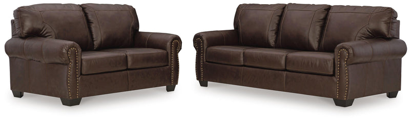 Ashley Furniture Colleton living room set with sofa and armchair, featuring neutral upholstery and modern design.