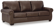 Ashley Furniture Colleton living room set with sofa and loveseat in a modern design, shown from an angled perspective.