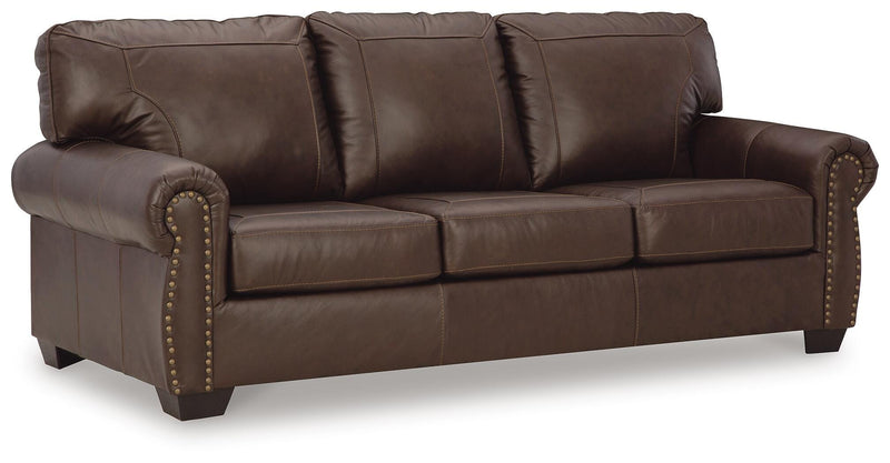 Ashley Furniture Colleton living room set with sofa and loveseat in a modern design, shown from an angled perspective.