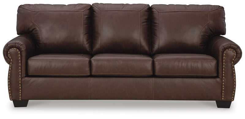 Ashley Furniture Colleton living room set featuring a sofa and loveseat with plush cushions and neutral fabric upholstery.