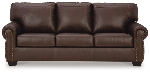 Ashley Furniture Colleton sofa with plush cushions and rolled arms, shown from a head-on view in a cozy living room setting.