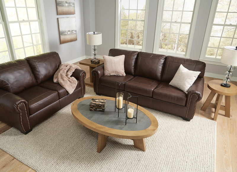 Ashley Furniture Colleton living room set featuring a sofa and armchair with neutral upholstery and modern design.