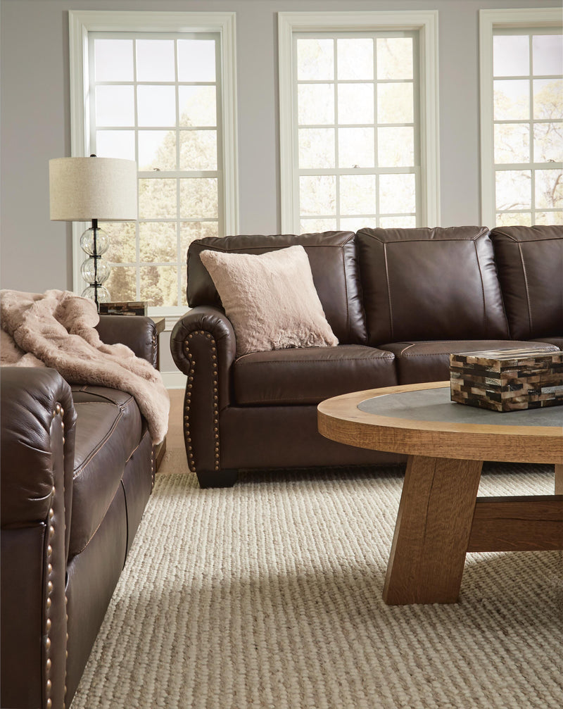 Ashley Furniture Colleton living room set with sofa and armchair in a modern design, shown in a cozy, stylish living space.