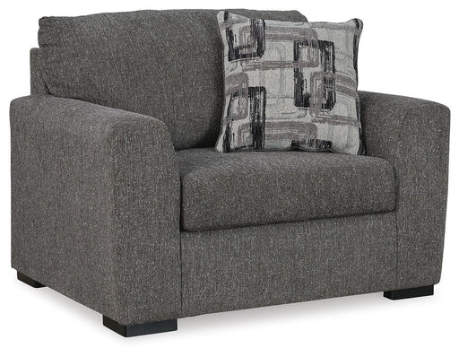 Oversized Ashley Furniture Gardiner chair with plush upholstery and wide armrests, shown from an angled side view.