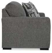 Ashley Furniture Gardiner Oversized Chair with plush fabric and wide armrests, shown from a side angle in a cozy living room setting.