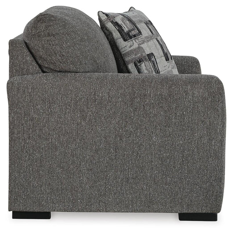 Ashley Furniture Gardiner Oversized Chair with plush fabric and wide armrests, shown from a side angle in a cozy living room setting.