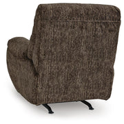 Ashley Furniture Stayfish recliner in dark brown leather, showing the plush backrest and armrests for comfortable seating.